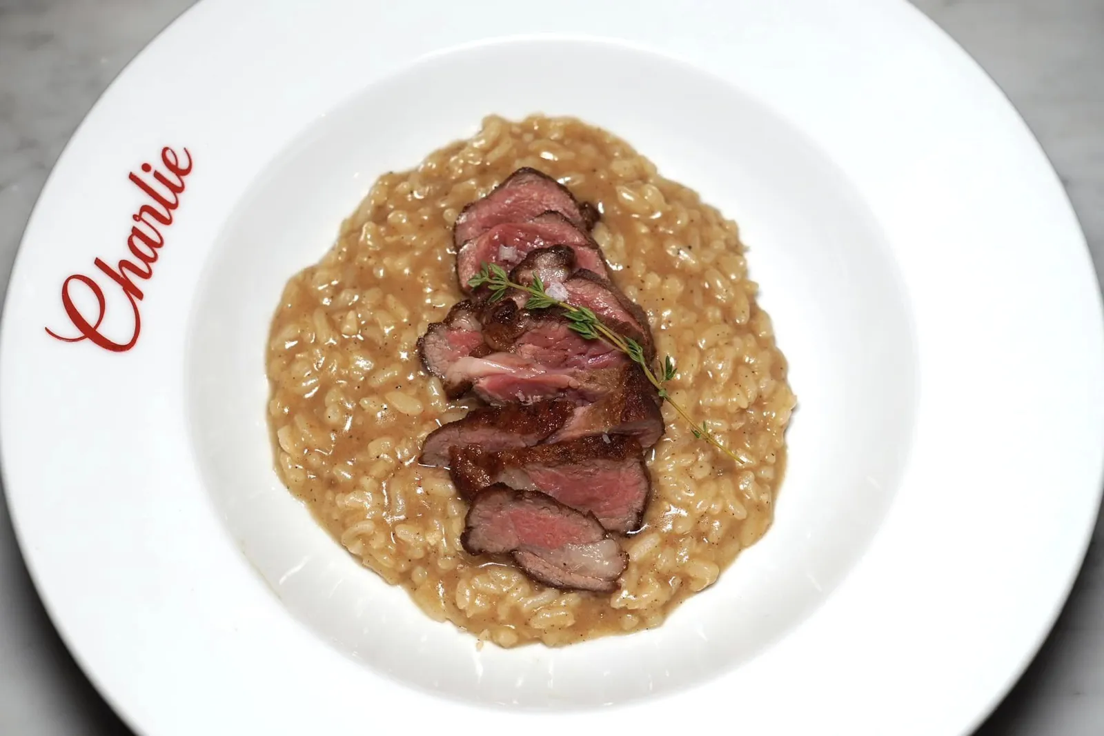 Lamb Chump Risotto (580++) Sliced Lamb Chump, Lamb Jus, Risotto ข้าว Risotto ปรุงให้สุกด้วย Lamb Jus เข้มข้น ด้านบนท็อปด้วยเนื้อแกะขนาดพอดีคำเตรียมมาที่ความสุกระดับ Medium พอดิบพอดี