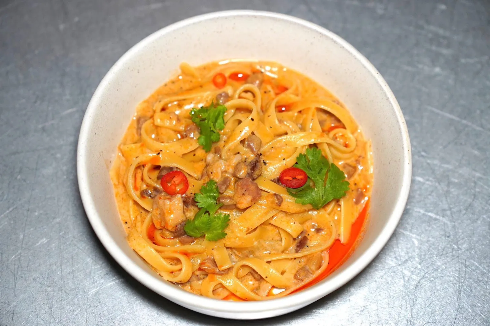 PORK RAGU PASTA (350++)ปิดท้ายด้วยพาสต้าเนื้อหมูผสมผสานกับซอสที่ได้รับแรงบันดาลใจมาจากน้ำพริกอ่อง